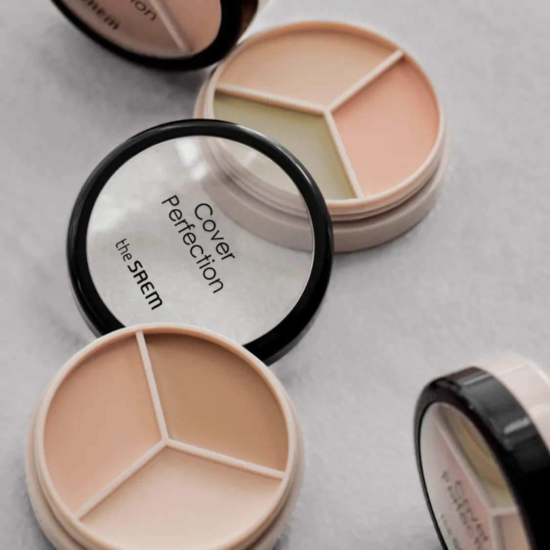 the SAEM Cover Perfection Triple Pot Concealer (4 colors); 0.16oz / 4.5g